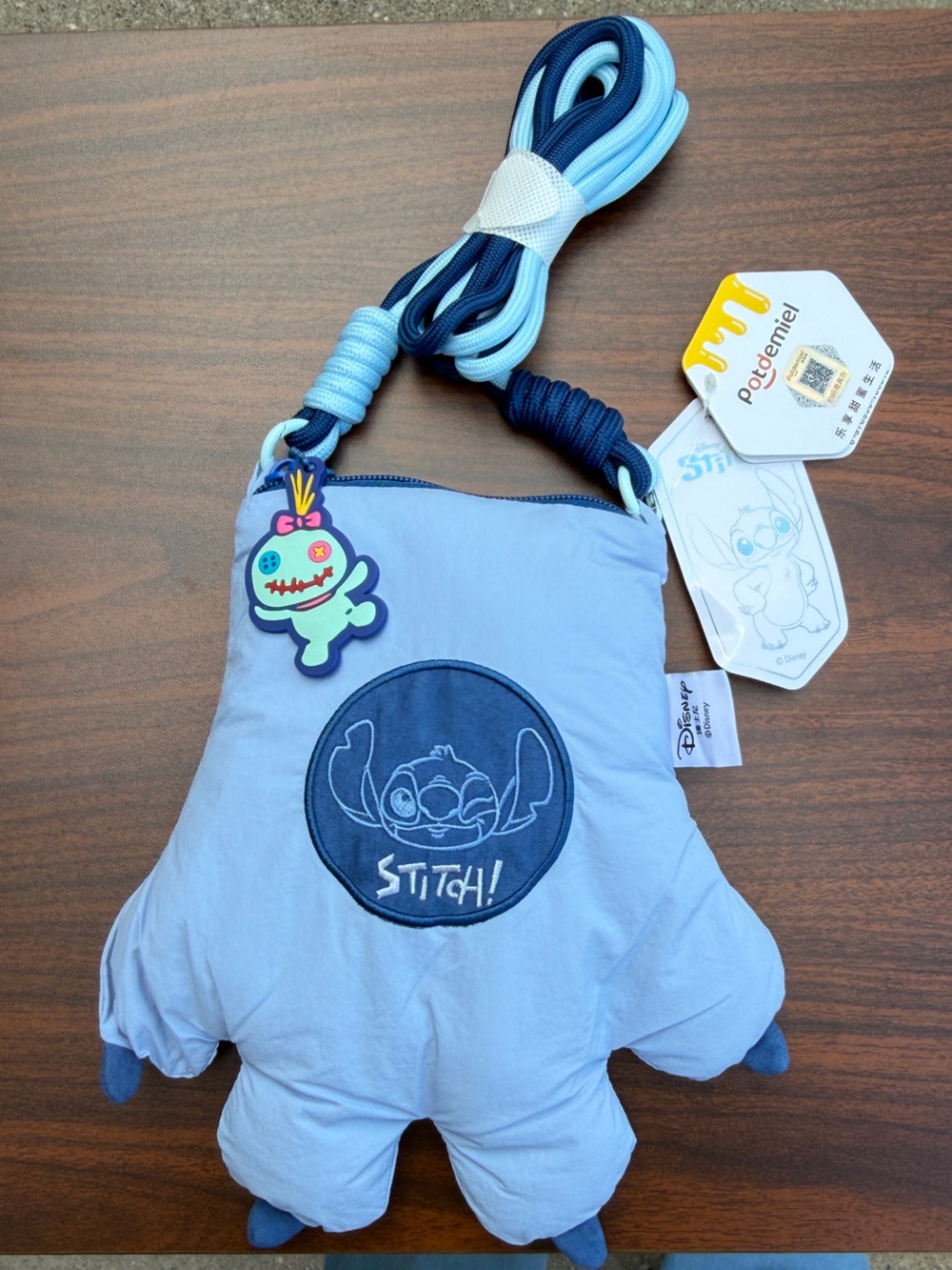 Brand new Disney Stitch Paw Crossbody Bag by Potdemiel with original tags!